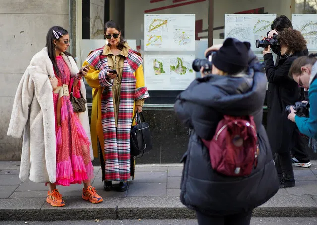 Fashionistas pose for photographers outside the BFC Showspace during London Fashion Week Women's A/W19 in London, Britain February 15, 2019. (Photo by Henry Nicholls/Reuters)