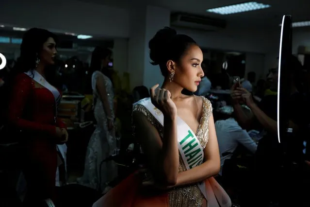 Kanwara Kaewjin of Thailand prepares backstage during the final show of the Miss International Queen 2019 transgender beauty pageant in Pattaya, Thailand on March 8, 2019. (Photo by Jorge Silva/Reuters)