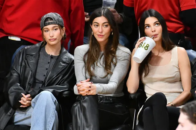 (L-R) American model and media personality Hailey Bieber, designer Sarah Staudinger and model Kendall Jenner attend a basketball game between the Los Angeles Lakers and the Oklahoma City Thunder at Crypto.com Arena on January 15, 2024 in Los Angeles, California. (Photo by Allen Berezovsky/Getty Images)