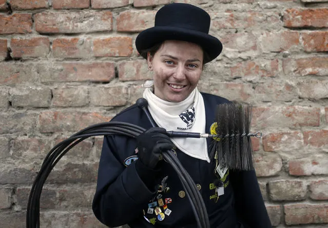 Dajana Djuric, 25, who has worked as a chimney sweep since the age of six, poses for a photograph after cleaning chimneys in Brcko, Bosnia and Herzegovina. Picture taken March 3, 2016. (Photo by Dado Ruvic/Reuters)