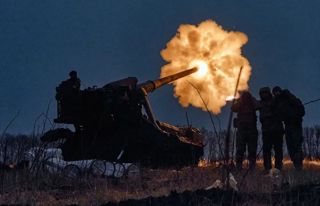 Ukrainian soldiers fire a Pion artillery system at Russian positions near Bakhmut, Donetsk region, Ukraine, Thursday, December 15, 2022. (Photo by LIBKOS/AP Photo)