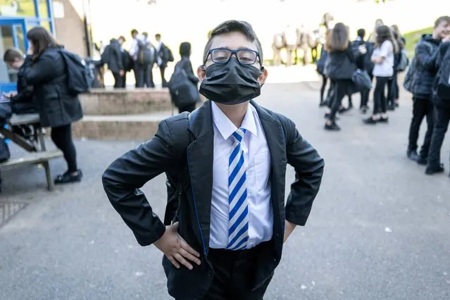 A child wearing a face mask poses for a photograph at Llanishen High School on September 20, 2021 in Cardiff, Wales. All children aged 12 to 15 across the UK will be offered a dose of the Pfizer-BioNTech Covid-19 vaccine. Parental consent will be sought for the schools-based vaccination programme. (Photo by Matthew Horwood/Getty Images)