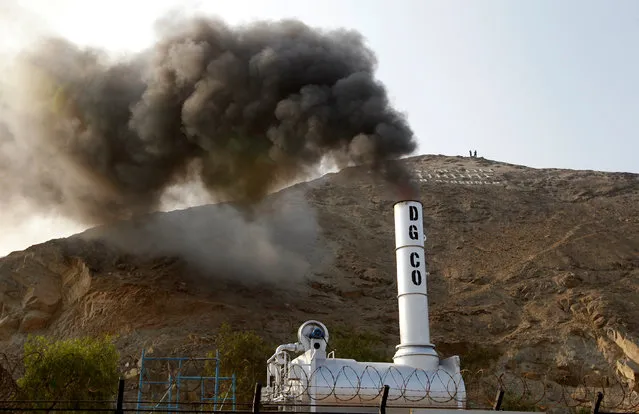 An incinerator expels smoke during the incineration of about 7.9 tons of drugs, seized during police operations, according to the Interior Ministry, in Lima, Peru February 2, 2017. (Photo by Guadalupe Pardo/Reuters)