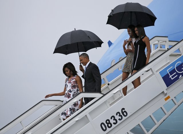 U.S. President Barack Obama, his wife Michelle, and their daughters Malia and Sasha, exit Air Force One as they arrive at Havana's international airport for a three-day trip, in Havana March 20, 2016. (Photo by Carlos Barria/Reuters)
