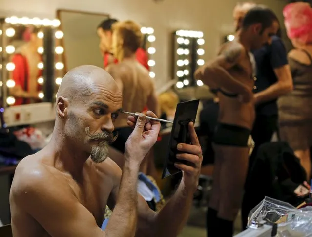 A boylesque performer prepares before the “Yodeling Lederhosen Boylesque Gala” at the Boylesque Festival in Vienna, Austria, May 15, 2015. Picture taken May 15, 2015. (Photo by Leonhard Foeger/Reuters)