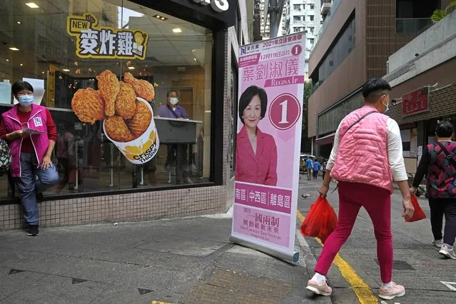 A banner of Regina Ip Lau Suk-yee, a pro-establishment candidate, is displayed on a street in Hong Kong, Thursday, December 16, 2021. Hong Kong voters are preparing to vote for the first time this weekend since election laws were changed, amid a dearth of opposition candidates months after the city began cracking down on dissent. The legislative elections will be held on Sunday, Dec. 19, 2021. (Photo by Kin Cheung/AP Photo)
