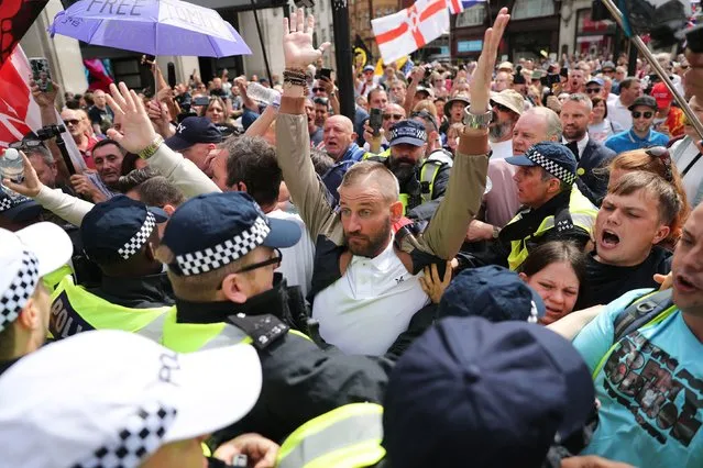 Tommy Robinson supporters in Oxford Street in London on August 3, 2019 protesting against his prison sentence after he was jailed for nine months for contempt of court over a video he broadcast on Facebook which featured defendants in a criminal trial. (Photo by Steve Parsons/PA Images via Getty Images)