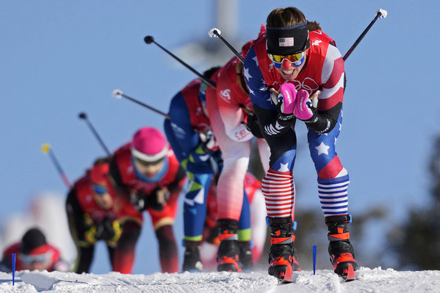 Rosie Brennan leads a group during the women's team sprint classic cross-country skiing competition at the 2022 Winter Olympics, Wednesday, February 16, 2022, in Zhangjiakou, China. (Photo by Aaron Favila/AP Photo)