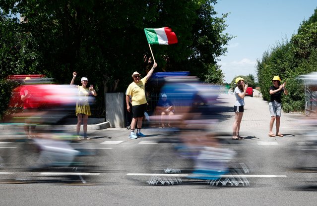 Fans wave flags during stage 2 of the Tour de France between Cesenatico and Bologne in Cesenatico, Italy on June 30, 2024Cesenatico, Italy on June 30, 2024. (Photo by Stephane Mahe/Reuters)