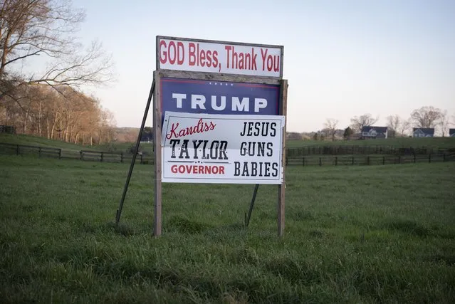Jesus, guns and babies as priority values of a gubernatorial candidate are tacked on to a Trump sign in rural north Georgia on April 6, 2022. (Photo by Robin Rayne/ZUMA Press Wire/Rex Features/Shutterstock)