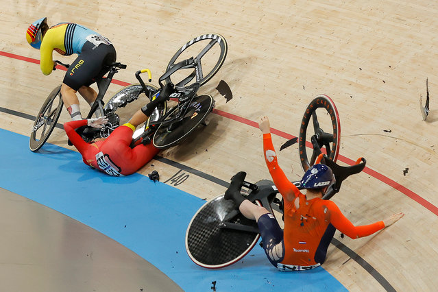 Belgium’s Nicky Degrendele (left), China’s Yuan Liying (centre) and Netherlands’ Steffie van der Peet crash in the women’s track cycling keirin quarter-finals at the National Velodrome, Saint-Quentin-en-Yvelines, on the thirteenth day of the 2024 Paris Olympic Games in France on Thursday, August 8, 2024. (Photo by Tom Jenkins/The Guardian)