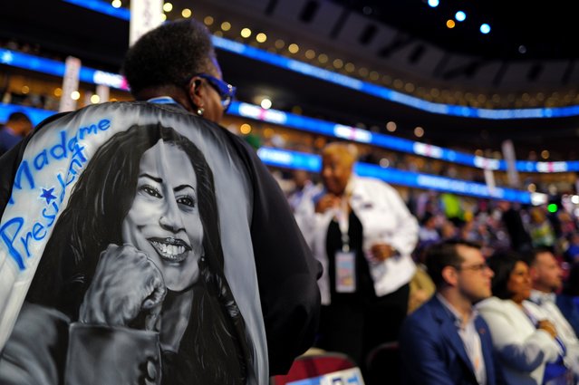 An attendee wears a jacket with the likeness of Democratic presidential candidate, U.S. Vice President Kamala Harris during the second day of the Democratic National Convention at the United Center on August 20, 2024 in Chicago, Illinois. Delegates, politicians, and Democratic Party supporters are gathering in Chicago, as current Vice President Kamala Harris is named her party's presidential nominee. The DNC takes place from August 19-22. (Photo by Brandon Bell/Getty Images)