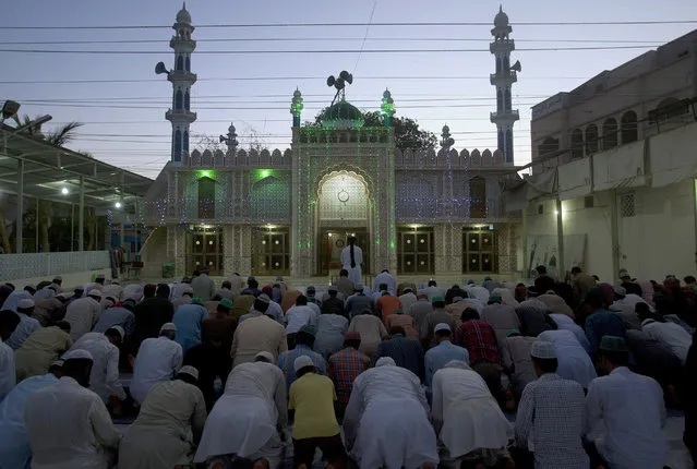People offer evening prayer at a mosque ahead of the Muslim month of Ramadan, in Karachi, Pakistan, Sunday, June 5, 2016. Muslims across the world will be observing the holy fasting month of Ramadan, when they refrain from eating, drinking and smoking from dawn to dusk. (Photo by Shakil Adil/AP Photo)