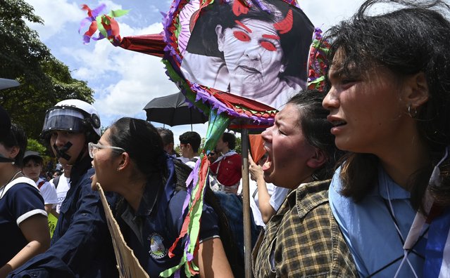 Teachers, unions and public university students march against education budget cuts put forward by Costa Rican President Rodrigo Chavez and his education minister Khatarina Müller, in San Jose, Costa Rica, Tuesday, June 20, 2023. (Photo by Carlos Gonzalez/AP Photo)