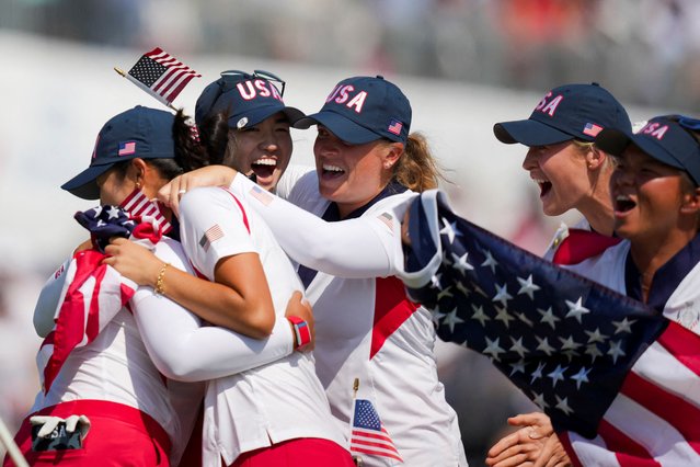 Team USA celebrates on the 18th green after winning the Solheim Cup against Team Europe at Robert Trent Jones Golf Club on September 15, 2024. (Photo by Aaron Doster/Imagn Images/Reuters)