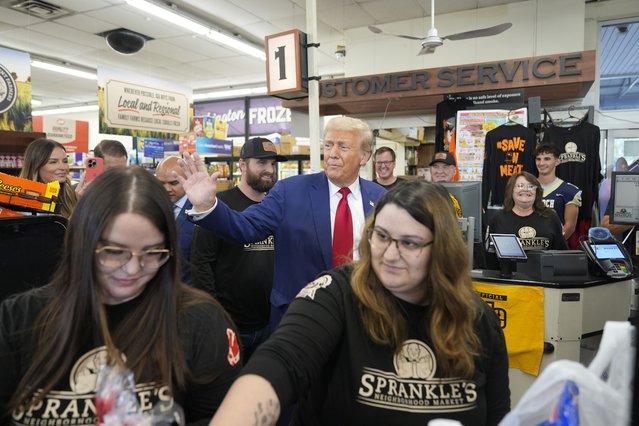 Republican presidential nominee former President Donald Trump waves as he visits Sprankle's Neighborhood Market in Kittanning, Pa., Monday, September 23, 2024. (Photo by Alex Brandon/AP Photo)