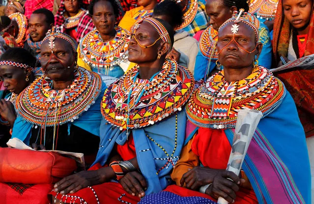 Maasai women dressed in traditional regalia attend a memorial service for late former Kenya's President Daniel Arap Moi at the Nyayo Stadium in Nairobi, Kenya on February 11, 2020. (Photo by Njeri Mwangi/Reuters)