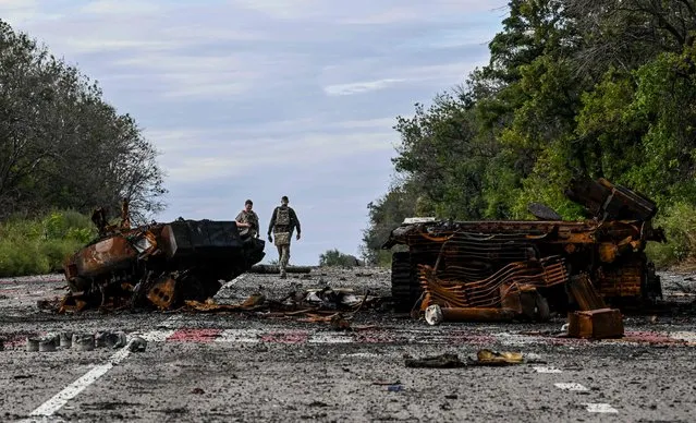 Destroyed armored vehicles litter the road in Balakliya, Kharkiv region, on September 10, 2022, amid the Russian invasion of Ukraine. Ukrainian forces said on September 10, 2022 they had entered the town of Kupiansk in eastern Ukraine, dislodging Russian troops from a key logistics hub in a lightning counter-offensive that has seen swathes of territory recaptured. (Photo by Juan Barreto/AFP Photo)