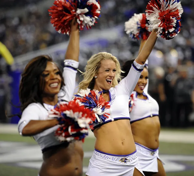 The Baltimore Ravens cheerleaders perform during the first half of an NFL football game against the Pittsburgh Steelers Thursday, September 11, 2014, in Baltimore. (Photo by Nick Wass/AP Photo)