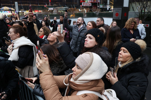 People try to get a photograph as George Clooney poses with cast members of “Goodnight and Goodluck” outside the Winter Garden Theater, in New York City, U.S., February 6, 2025. (Photo by Caitlin Ochs/Reuters)
