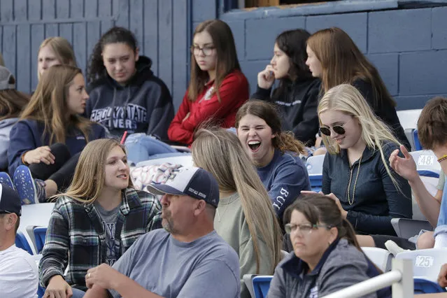 In this Tuesday, June 16, 2020, photo, Yakima Valley Pepsi Pak baseball fans watch the Senior Legion team play a game in Selah, Wash. The team continues to play games despite not approved to do so by the Yakima Health District or allowed under state restrictions so long as Yakima County remains in Phase 1 of the coronavirus reopening. Yakima, Benton and Franklin counties remain in Phase 1, meaning only essential businesses are open; restaurant service is limited to takeout and delivery; and limited outdoor recreation. (Photo by Elaine Thompson/AP Photo)