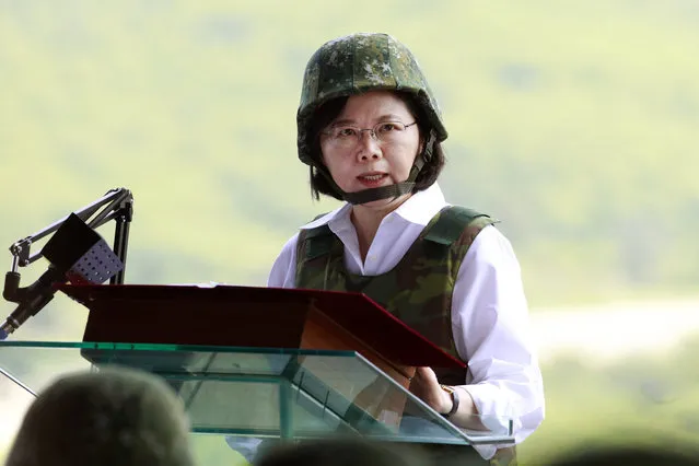 Taiwan's President Tsai Ing-wen wearing a camouflage helmet and bulletproof vest delivers a speech during the annual Han Kuang exercises in Pingtung county, Southern Taiwan, Thursday, August 25, 2016. (Photo by Chiang Ying-ying/AP Photo)