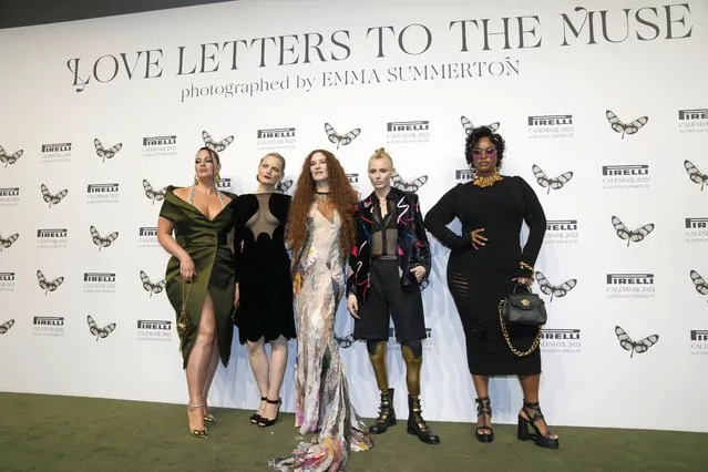 From left, models Ashley Graham, Guinevere Van Seenus, photographer Emma Summerton, models Lauren Wasser, and Precious Lee pose as they arrive to attend the 2023 Pirelli calendar gala at the hangar Bicocca in Milan, Italy, Wednesday, November 16, 2022. The 2023 calendar titled “Love Letters to the Muse” was shot by Australia photographer Emma Summerton features models representing their personal passions. (Photo by Luca Bruno/AP Photo)