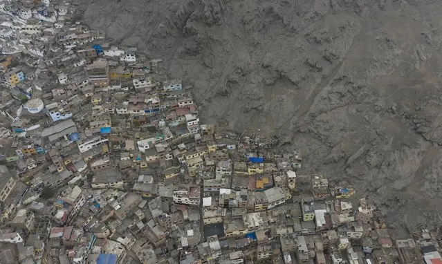 The Rimac neighborhood is seen from above amid the new coronavirus pandemic, in Lima, Peru, Wednesday, June 24, 2020. (Photo by Rodrigo Abd/AP Photo)