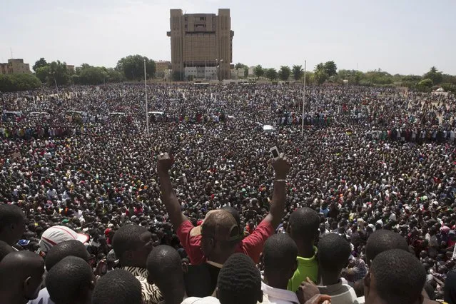 Anti-government protesters gather in the Place de la Nation in Ouagadougou, capital of Burkina Faso, October 31, 2014. (Photo by Joe Penney/Reuters)