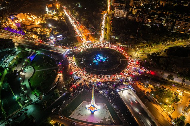 An aerial view of Syrian people flocked to the streets in the capital Damascus to celebrate US President Donald Trump's decision to lift sanctions in Damascus, Syria on May 13, 2025. (Photo by Amadeusz Mikolaj Swierk/Anadolu via Getty Images)