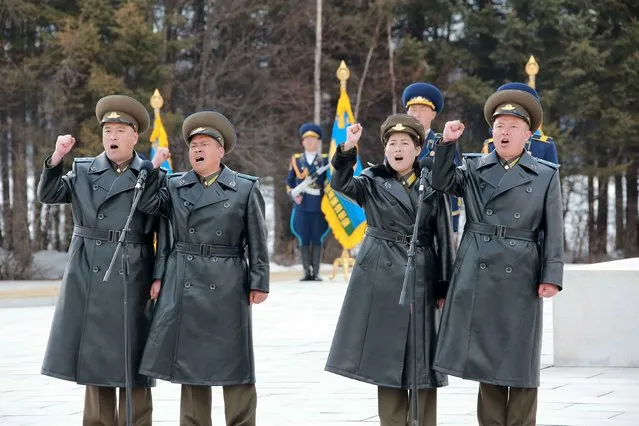 Military personnel cheer during a visit by North Korean leader Kim Jong Un to Korean People's Army pilots who have completed a tour of battle sites in the area of Mt Paektu, in this undated photo released by North Korea's Korean Central News Agency (KCNA) on April 19, 2015. (Photo by Reuters/KCNA)