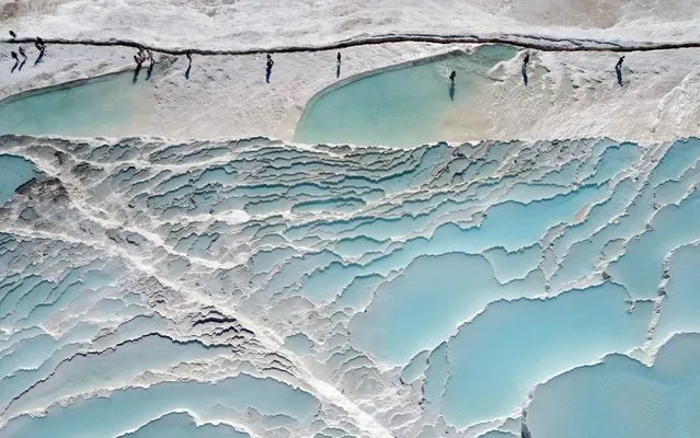 An aerial drone view of Pamukkale white travertine terraces on September 07, 2020 in Denizli, Turkey. Pamukkale is a UNESCO World Heritage Site known for its mineral-rich thermal waters and white travertine terraces. (Photo by Sebahatdin Zeyrek/Anadolu Agency via Getty Images)