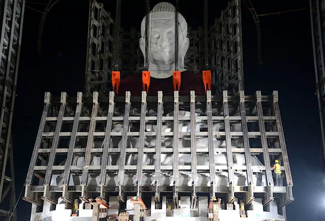 This handout photo from the Myanmar junta's information team taken and released on February 13, 2023, shows construction of the Maravijaya Buddha statue in Naypyidaw, which state media claims will be the world's largest marble statue of the Buddha when it is completed. (Photo by Handout/Myanmar Military Information Team via AFP Photo)