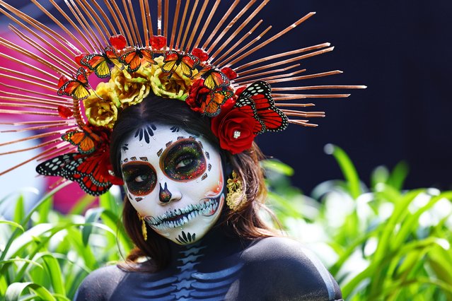 A Day of the Dead performer is seen in the Paddock during previews ahead of the F1 Grand Prix of Mexico at Autodromo Hermanos Rodriguez on October 24, 2024 in Mexico City, Mexico. (Photo by Mark Thompson/Getty Images)