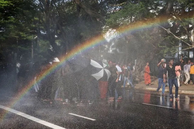 Police use water cannons to disperse Inter University students federation members during a protest demanding implementation of the promised changes to the governing system, in Colombo, Sri Lanka on March 7, 2023. (Photo by Dinuka Liyanawatte/Reuters)