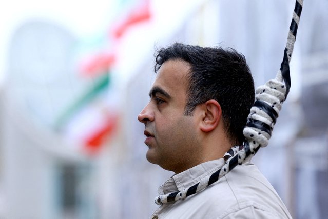 A man wears a noose around his neck as supporters of the National Council of Resistance of Iran gather to protest against the death penalty in their home country and for the Islamic Revolutionary Guard Corps to be declared a “terrorist organization”, in Berlin, Germany on November 14, 2024. (Photo by Lisi Niesner/Reuters)