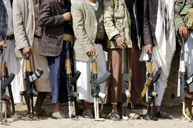 Tribesmen loyal to the Houthi movement hold their weapons at a gathering to show their support for the group, in Yemen's capital Sanaa December 15, 2015. (Photo by Khaled Abdullah/Reuters)