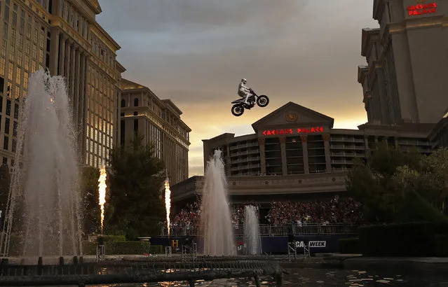Travis Pastrana jumps the fountain at Caesars Palace on a motorcycle Sunday, July 8, 2018, in Las Vegas. Pastrana recreated three of Evel Knievel's iconic motorcycle jumps on Sunday, including the leap over the fountains of Caesars Palace that left Knievel with multiple fractures and a severe concussion. (Photo by John Locher/AP Photo)