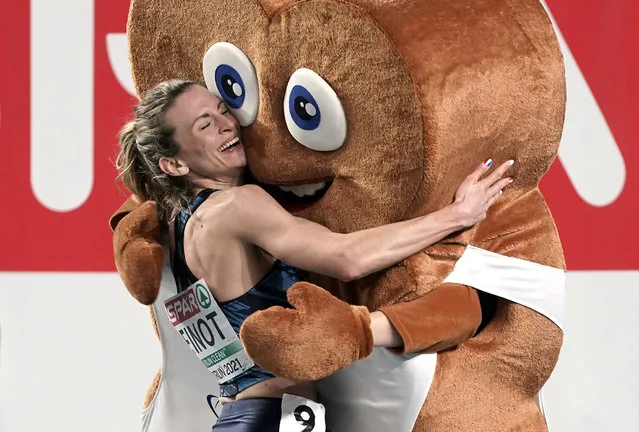 France's Alice Finot celebrates next to the mascot winning silver in the Women's 3000m final at the 2021 European Athletics Indoor Championships in Torun on March 5, 2021. (Photo by Aleksandra Szmigiel/Reuters)