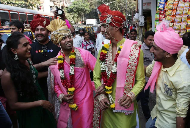 Supporter of the lesbian, gay, bisexual and transgender community dress as grooms of a same-s*x marriage during a gay pride parade in Mumbai, India, Saturday, January 31, 2015. Gay rights supporters waved flags and danced during the march to celebrate gay pride and to push for the repeal of a colonial-era law that makes homosexuality a crime. (Photo by Rajanish Kakade/AP Photo)