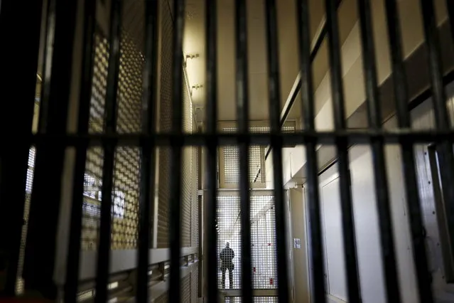 A guard stands behind bars at the Adjustment Center during a media tour of California's Death Row at San Quentin State Prison in San Quentin, California December 29, 2015. (Photo by Stephen Lam/Reuters)