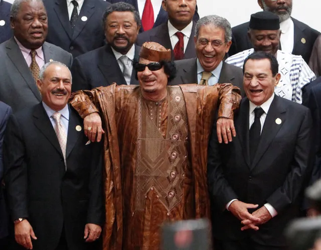 Libyan leader Muammar al-Gaddafi (C) leans on the shoulders of former Egyptian President Hosni Mubarak (centre R) and President of Yemen, Ali Abdullah Saleh (centre L) as they laugh during a photocall before the second Afro-Arab Summit in Sirte, Libya October 10, 2010. (Photo by Asmaa Waguih/Reuters)