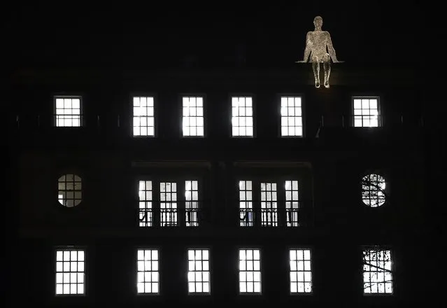 An illuminated section of "The Travellers" by Cedric Le Borgne is seen on a building in St. James's Square as part of the "Lumiere" festival in London, Britain January 14, 2016. The event which takes place over four evenings in the capital sees the illumination of famous landmarks, and the display of artworks by international artists. (Photo by Toby Melville/Reuters)