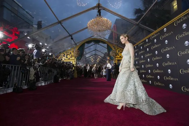 Cast member Lily James poses at the premiere of "Cinderella" at El Capitan theatre in Hollywood, California March 1, 2015. The movie opens in the U.S. on March 13. REUTERS/Mario Anzuoni  (UNITED STATES - Tags: ENTERTAINMENT)