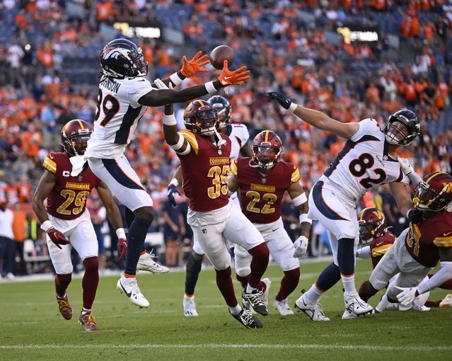 Denver Broncos wide receiver Brandon Johnson (89) catches a Hail Mary pass in the end zone for a t\touchdown as time runs out during the game against the Washington Commanders at Empower Field at Mile High on September 17, 2023. (Photo by John McDonnell/The Washington Post)