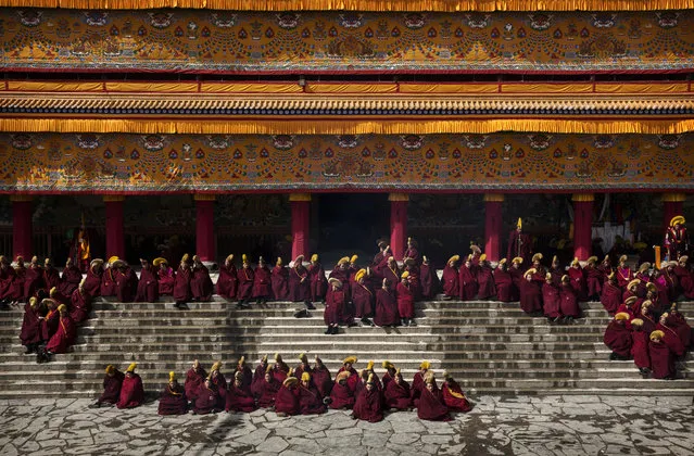 Tibetan Buddhist monks gather during Monlam or the Great Prayer rituals on March 5, 2015 at the Labrang Monastery, Xiahe County, Amdo, Tibetan Autonomous Prefecture, Gansu Province, China. (Photo by Kevin Frayer/Getty Images)