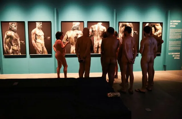 Residents take part in a nudist visit to the Archaeology Museum of Catalonia about The Bronzes of Race exhibition of Luigi Spina’s photographs depicting two large Greek bronze statues of the naked in Barcelona, Spain on October 28, 2023. (Photo by Nacho Doce/Reuters)