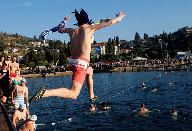 Revellers take part in New Year's Jump into the Sea in Portoroz, Slovenia January 1, 2017. (Photo by Srdjan Zivulovic/Reuters)