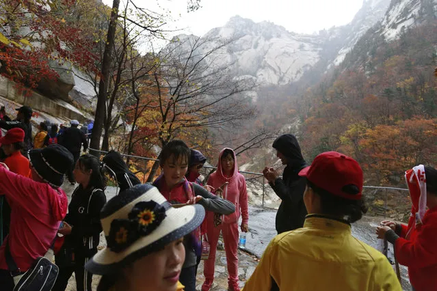 In this October 23, 2018, photo, tourists visit Mount Kumgang in North Korea. (Photo by Dita Alangkara/AP Photo)