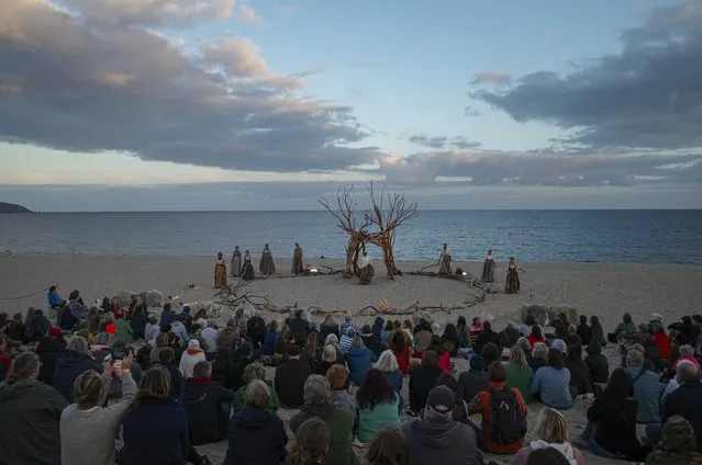 Wildworks Theatre company performs “I am Kevin” on Carlyon Bay beach on August 20, 2022 in St Austell, Cornwall, England. The first Wildworks show from artistic director Mydd Pharo, following the passing of founder Bill Mitchell in 2017, “I am Kevin” is a new “fairytale to set the world on fire”. Showgoers are invited to let their imaginations run wild on a journey of impossibility, joining a young boy on his eventful quest to find the light in the darkness. (Photo by Hugh R Hastings/Getty Images)